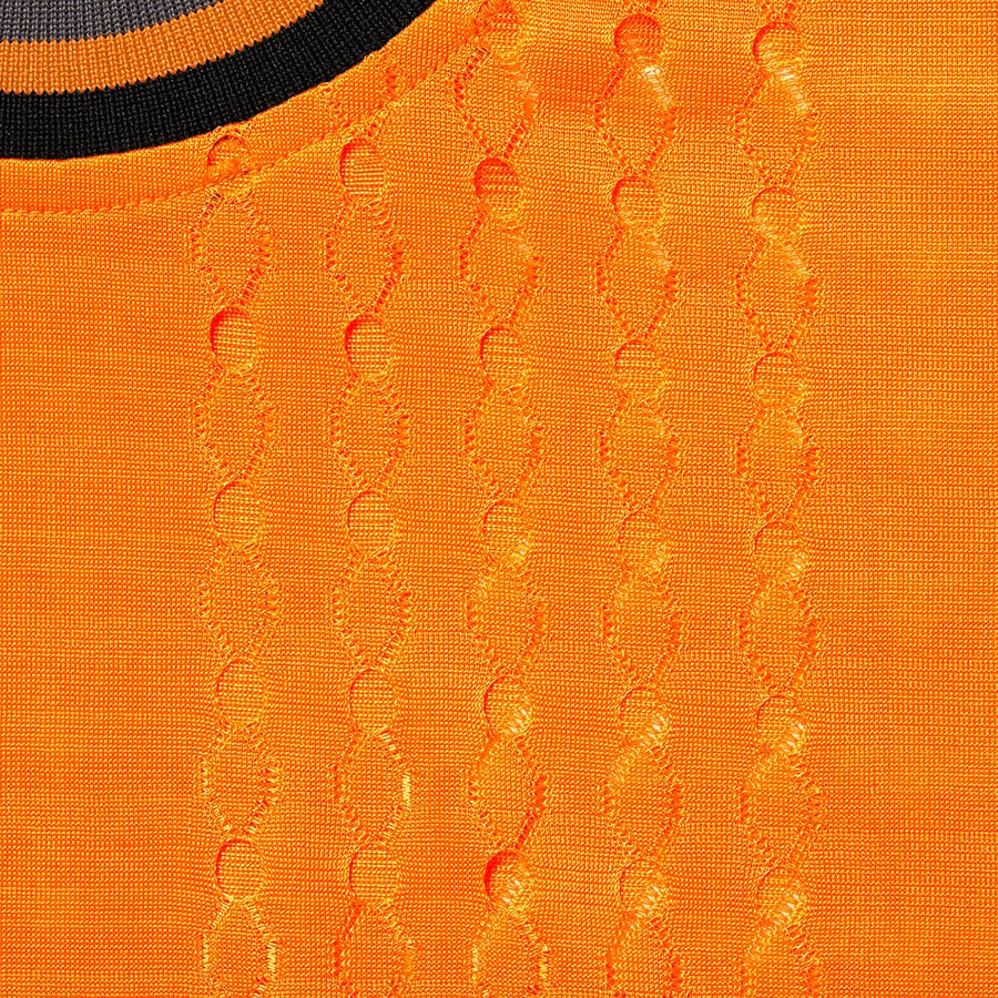 Details on Perforated Stripe Warm Up Top Orange from spring summer
                                                    2022 (Price is $78)